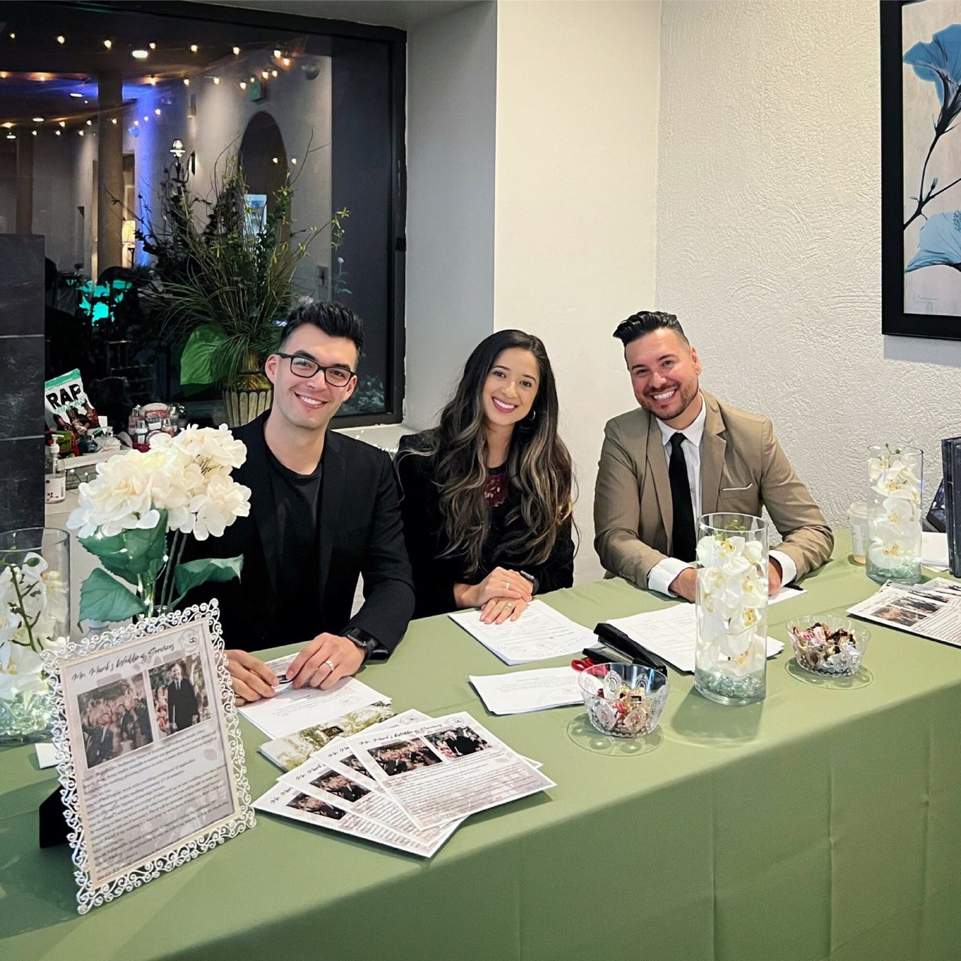 Mr. Mark meeting couples at a wedding event booth